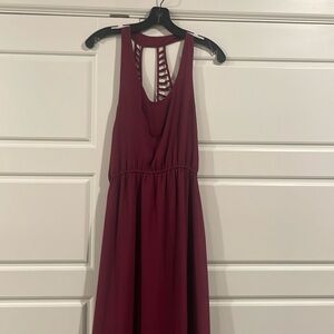 Wine colored maxi dress. Sleeveless with razor back and low slits on front